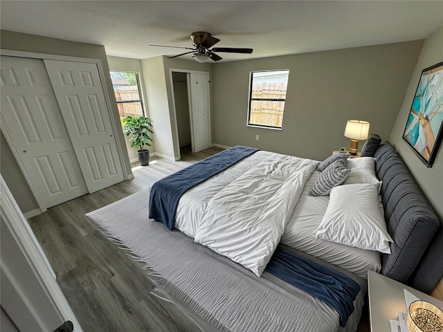 bedroom with ceiling fan and hardwood / wood-style floors