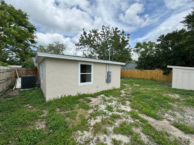 view of yard featuring central AC