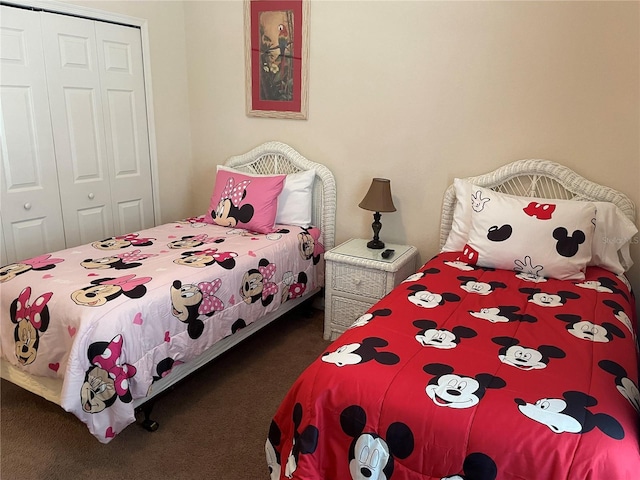 carpeted bedroom featuring a closet