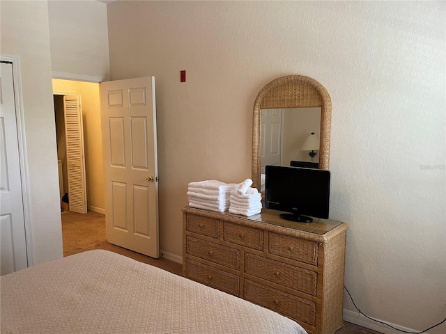 bedroom with light colored carpet