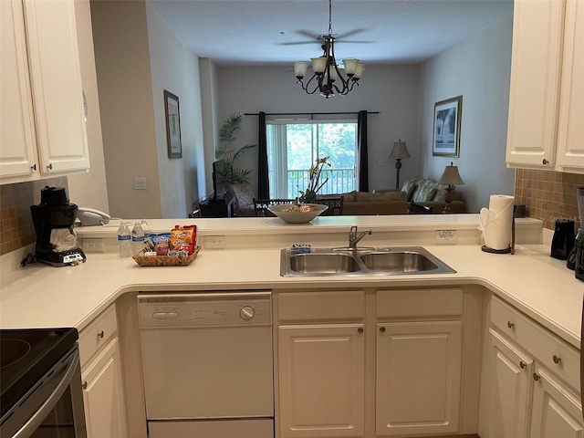 kitchen with dishwasher, tasteful backsplash, kitchen peninsula, a chandelier, and white cabinets