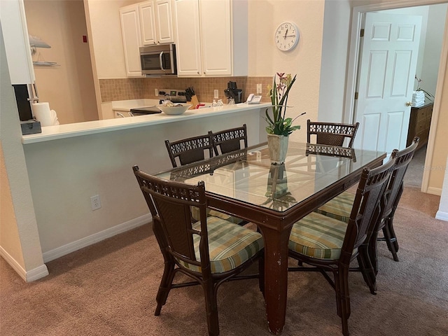 view of carpeted dining space