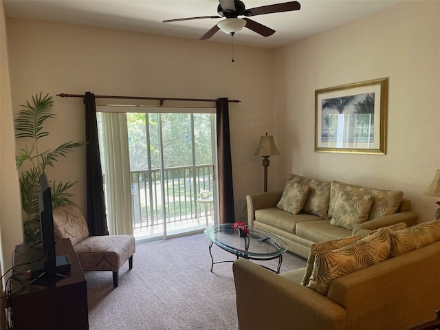 living room featuring carpet and ceiling fan