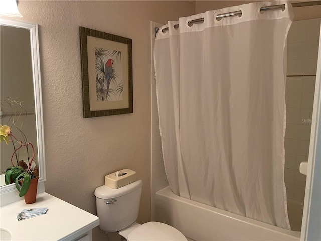 full bathroom with vanity, shower / bathtub combination with curtain, and toilet