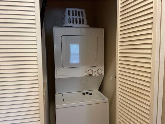 washroom with stacked washer and dryer