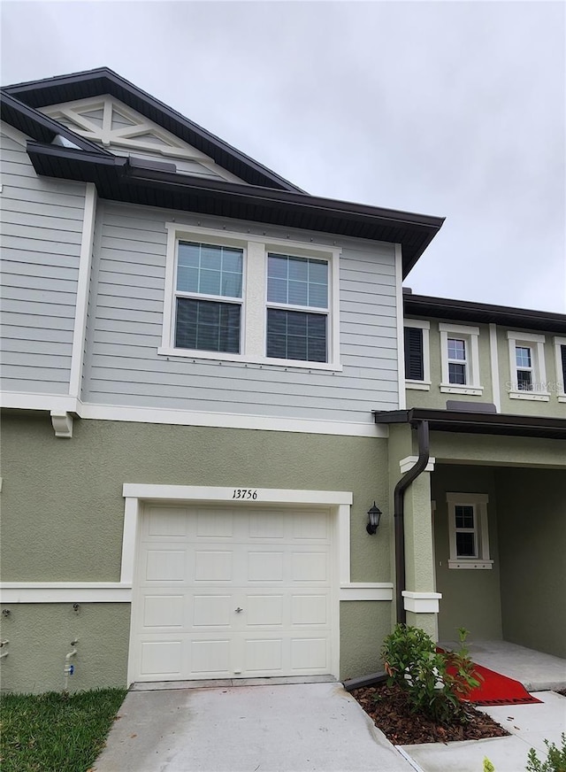 view of side of property with a garage