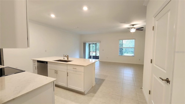 kitchen with stainless steel dishwasher, an island with sink, white cabinets, ceiling fan, and sink