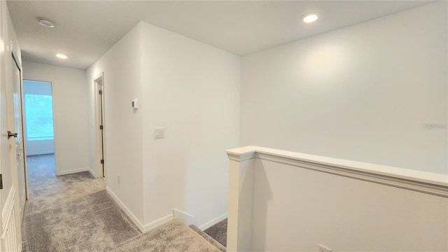 hallway with carpet flooring