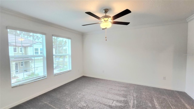 carpeted empty room with ceiling fan and crown molding