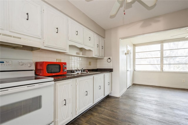 kitchen with backsplash, white cabinets, electric stove, sink, and dark hardwood / wood-style flooring