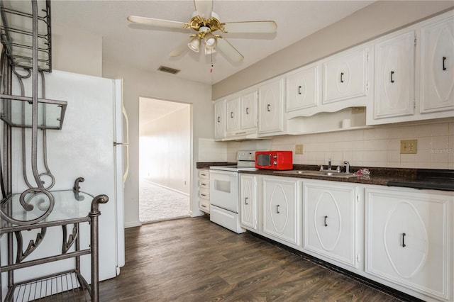 kitchen with electric range, sink, white cabinets, and ceiling fan