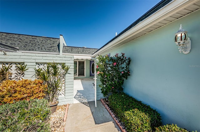 property entrance featuring a patio area