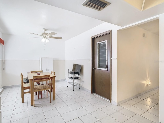 tiled dining area featuring ceiling fan