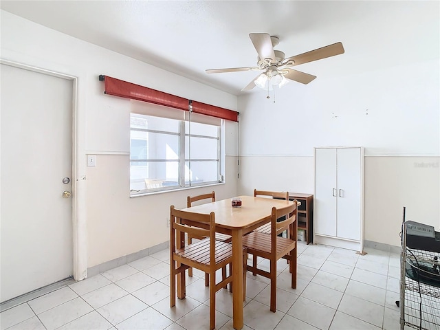 dining room with ceiling fan and light tile patterned floors