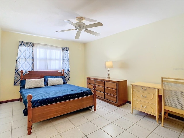 bedroom with ceiling fan and light tile patterned flooring