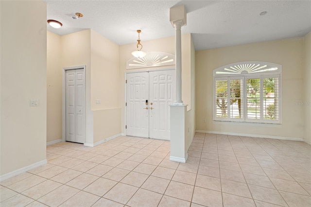 entrance foyer with light tile patterned floors