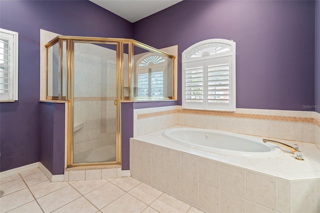 bathroom with shower with separate bathtub and tile patterned floors