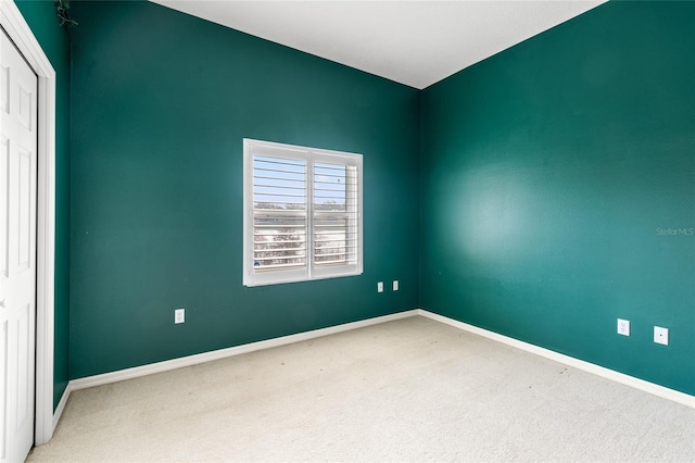 unfurnished room with carpet floors