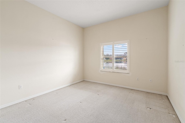 spare room with light carpet