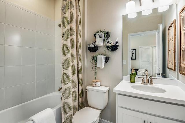 full bathroom featuring shower / tub combo, vanity, and toilet