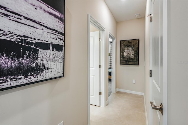 hall featuring light tile patterned floors