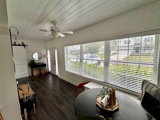 interior space featuring wood ceiling, ceiling fan, and a healthy amount of sunlight