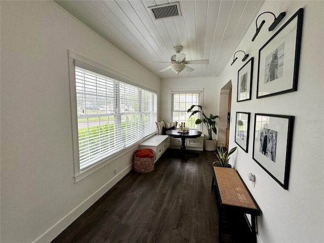 hallway with dark hardwood / wood-style floors and wooden ceiling