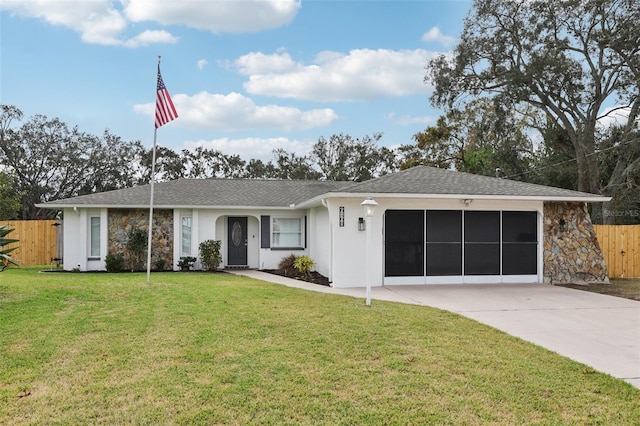 single story home with a garage and a front yard