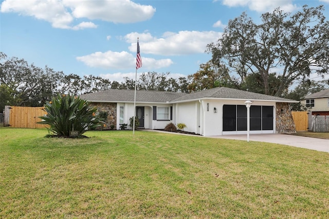 ranch-style home with a garage and a front yard