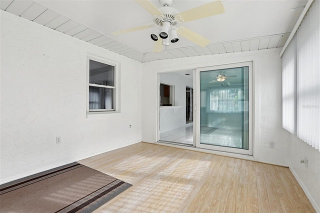 empty room featuring ceiling fan and light hardwood / wood-style flooring