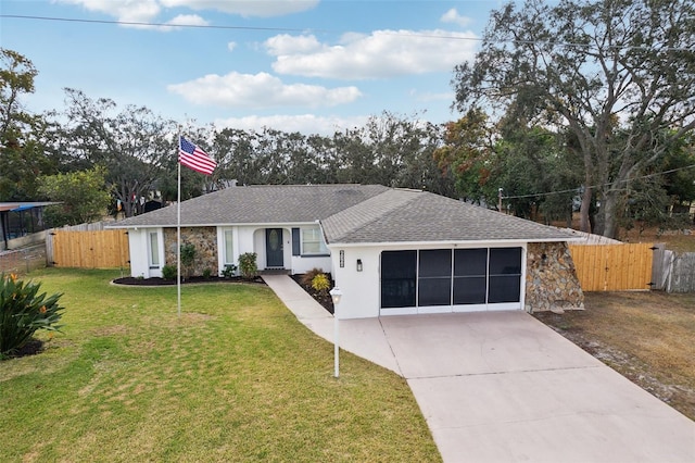 ranch-style home with a garage and a front yard