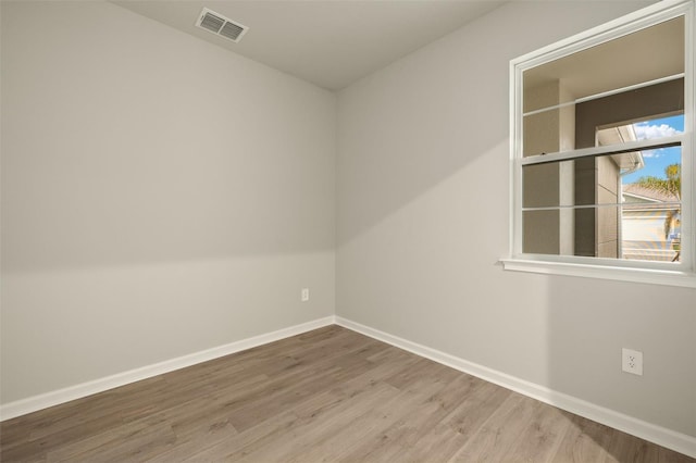 empty room featuring wood-type flooring