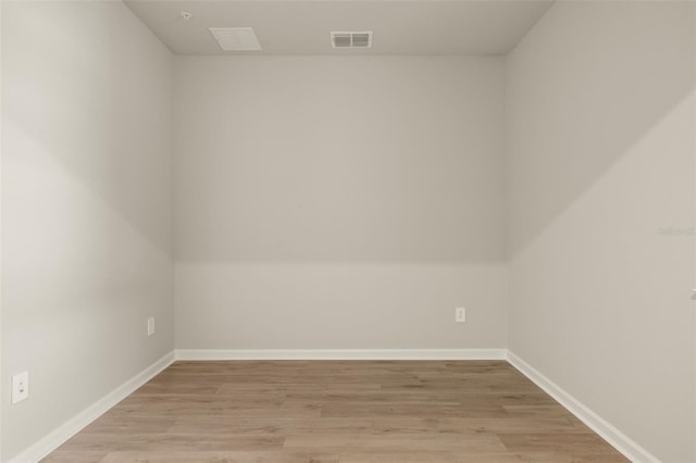 spare room with light hardwood / wood-style flooring