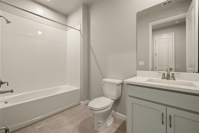 full bathroom with vanity, tile patterned floors, washtub / shower combination, and toilet