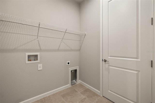 laundry room featuring light tile patterned floors, hookup for a washing machine, and hookup for an electric dryer