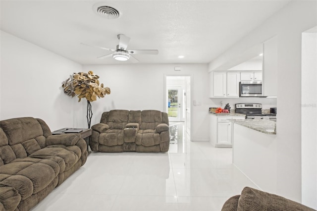 living room with ceiling fan