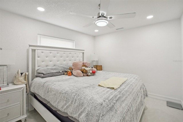 bedroom featuring ceiling fan and light tile patterned flooring