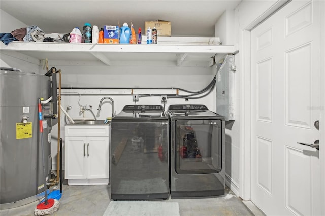 laundry area with cabinets, sink, separate washer and dryer, and water heater