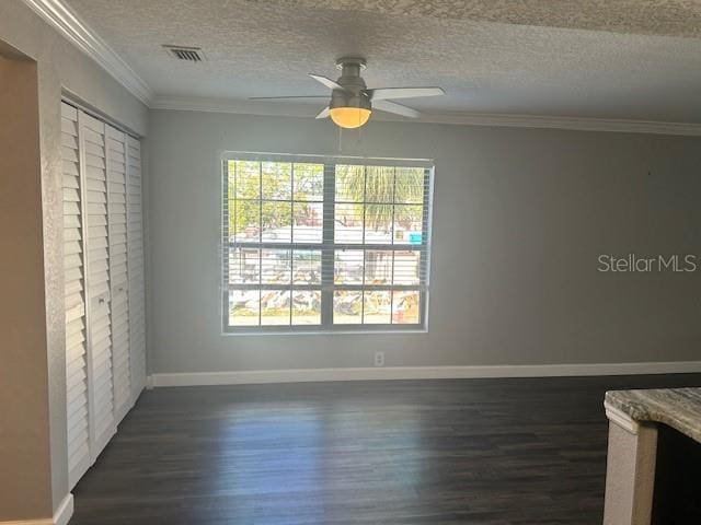 unfurnished bedroom featuring dark hardwood / wood-style floors, ceiling fan, a textured ceiling, and a closet