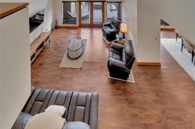 living room with dark wood-type flooring