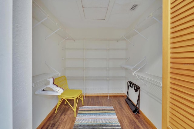 spacious closet featuring hardwood / wood-style flooring