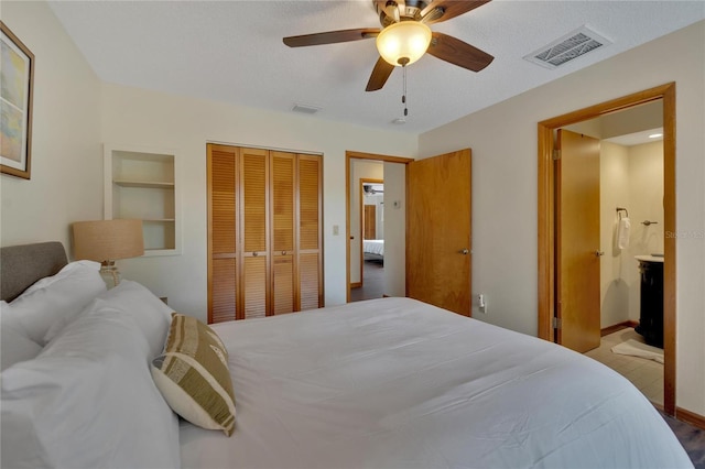 bedroom with connected bathroom, ceiling fan, a closet, and a textured ceiling