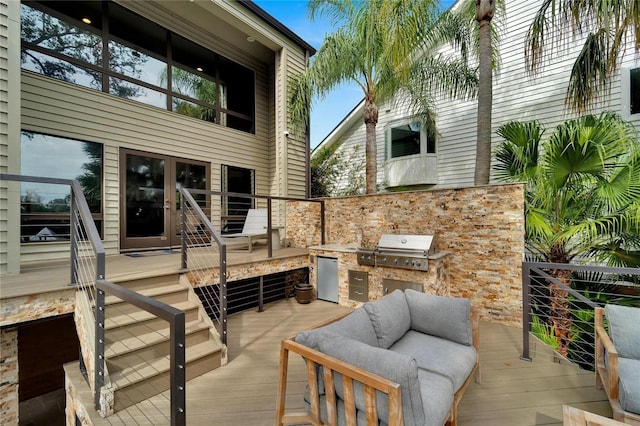 view of patio featuring a grill, area for grilling, and a wooden deck