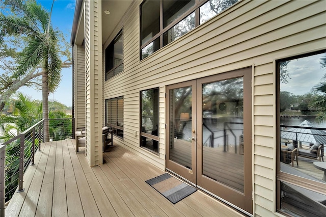 wooden deck with a water view