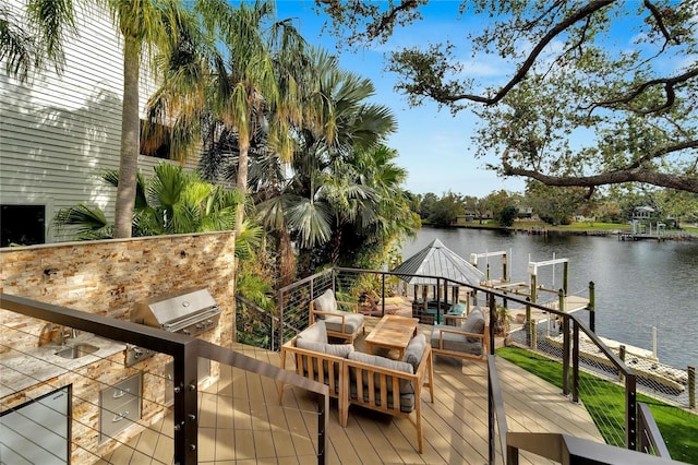 view of dock with an outdoor living space and a water view