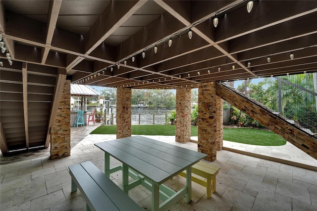 view of patio featuring a water view