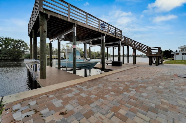 dock area with a water view