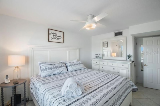 bedroom with ceiling fan and light tile patterned floors