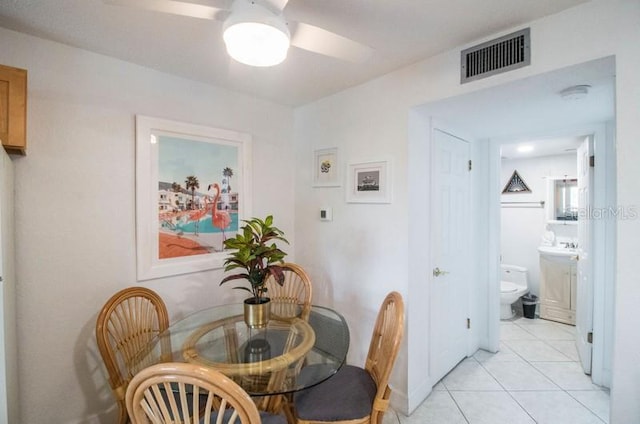 dining room featuring ceiling fan and light tile patterned floors