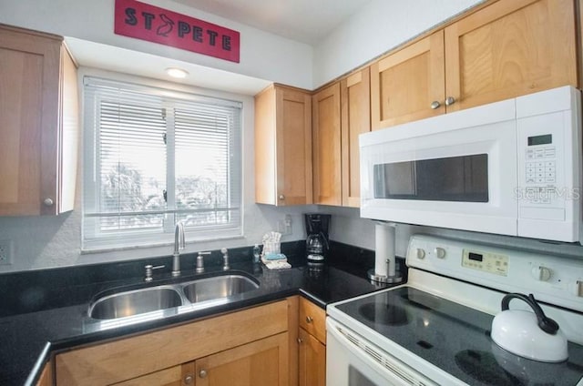 kitchen featuring sink and white appliances